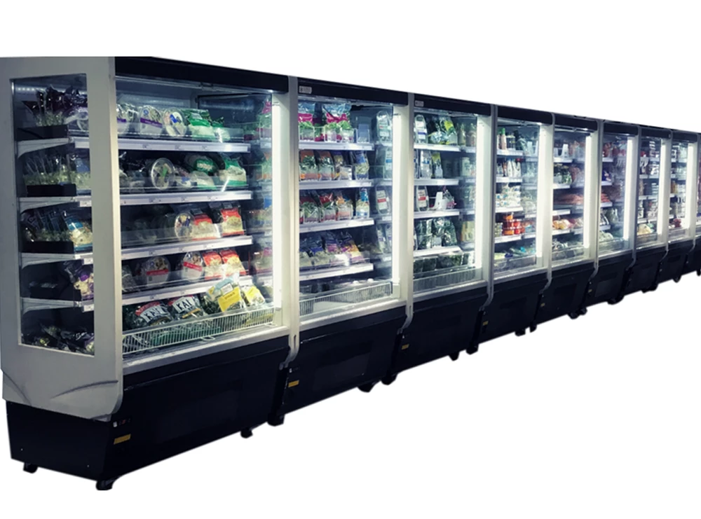 Row of glass-fronted refrigerators displaying various packaged food items, predominantly in bright colours.