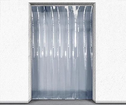 Transparent plastic strip curtains hang in a doorway, framed by a white wall.