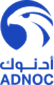 ADNOC logo in blue featuring a stylised wave design and Arabic text underneath.