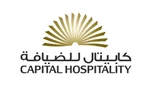 Gold and black logo for Capital Hospitality, featuring a stylised sunburst design above the name.