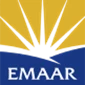 Emaar logo featuring a yellow background with a blue base and sunburst design.