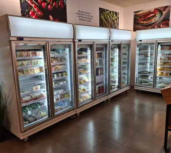 Chilled display cabinets filled with various packaged foods, set against a neutral background.