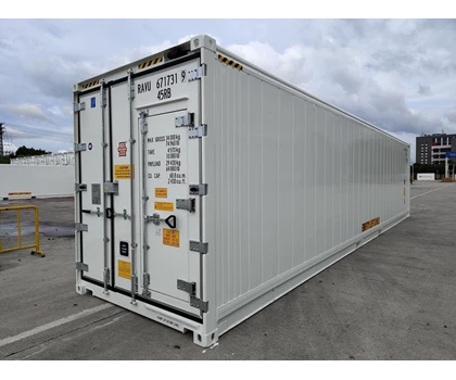 White shipping container with metal locks, set against a cloudy sky and concrete background.