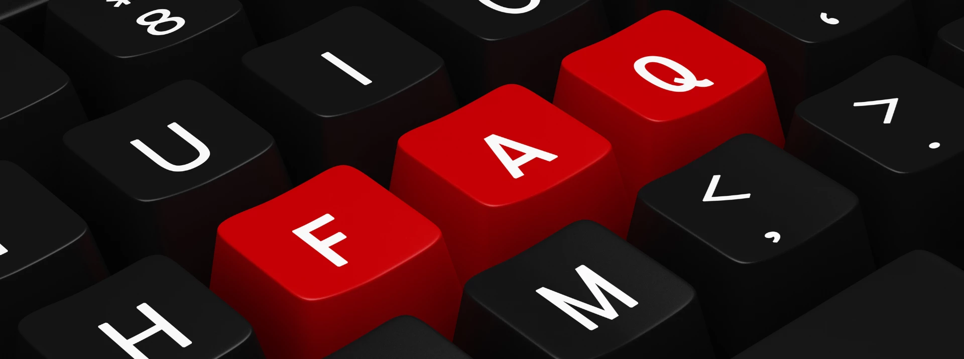 Close-up of black and red keyboard keys, prominently featuring the letters 