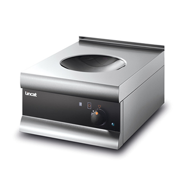 Induction wok with a sleek silver finish and a circular cooking surface.