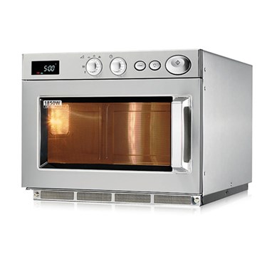 Silver commercial microwave oven with a glass door, displaying a warm light inside.
