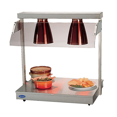 Double heating lamp with copper shades, stainless steel base, and dishes of food underneath.