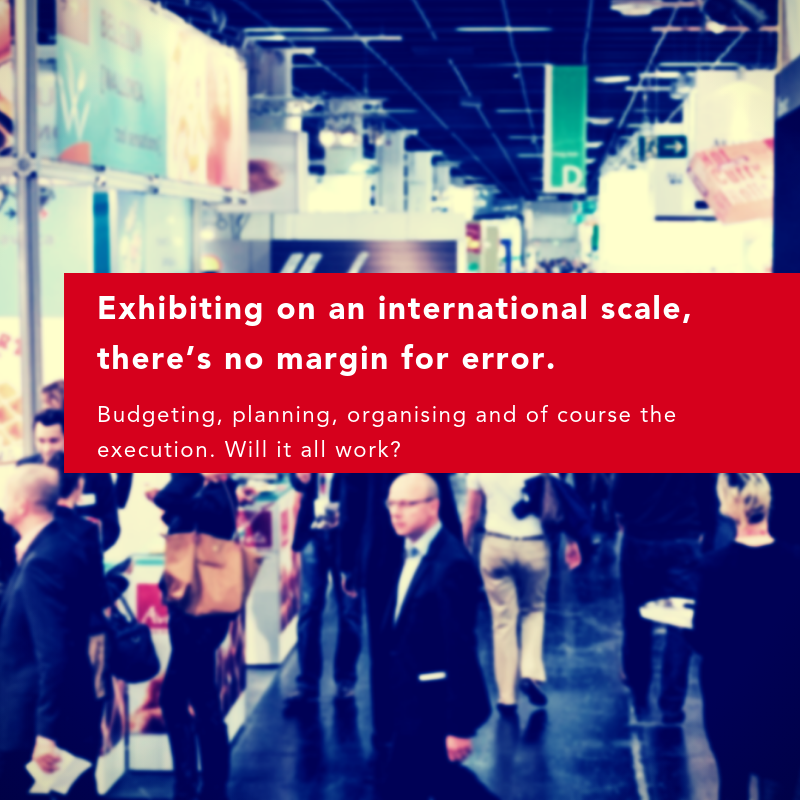 Crowd of professionals in a busy exhibition hall, with vibrant banners and a red overlay text.