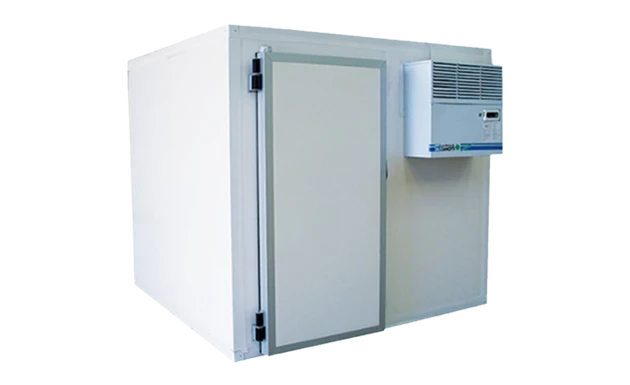 White cold room with a grey door and an air conditioning unit on the side.