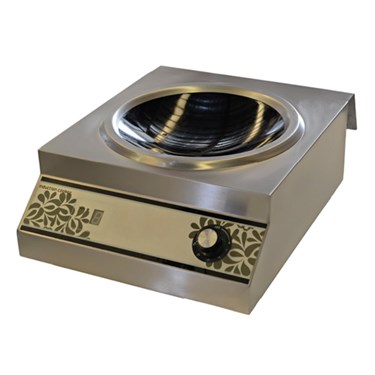 Stainless steel cooking appliance with a black ceramic surface and decorative gold accents.