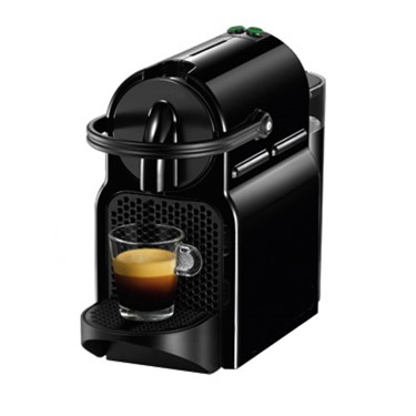 Compact black coffee machine with a glass of espresso on the drip tray.